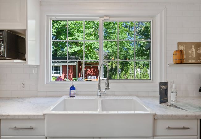 Farmhouse sink with window looking to back garden